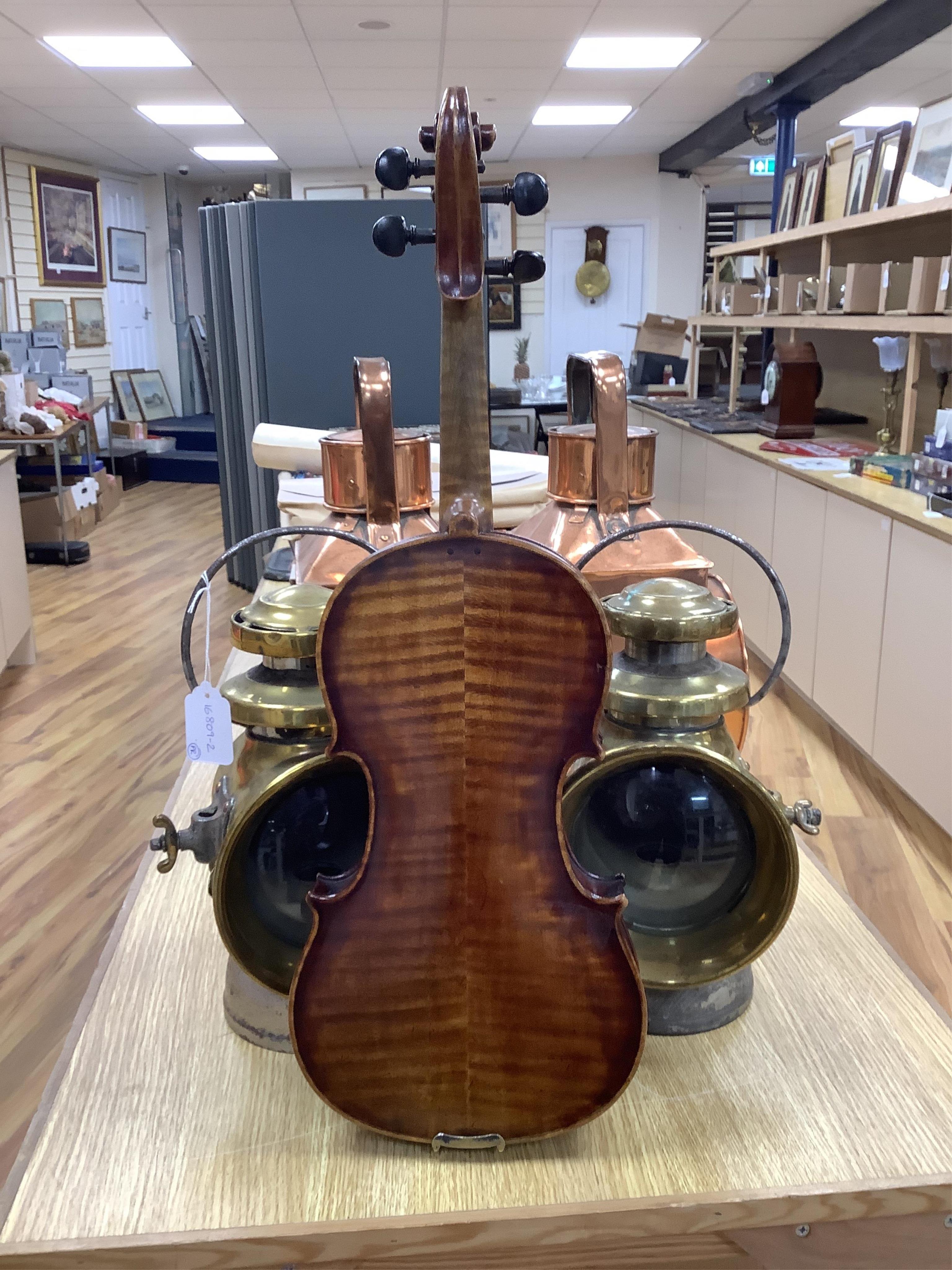 A cased 19th century English violin, with label reading George Craske, Fecit 1842, Edward Crompton, 54, Barton Arcade, Deansgate, Manchester, body length 36cm. Condition - fair to good.